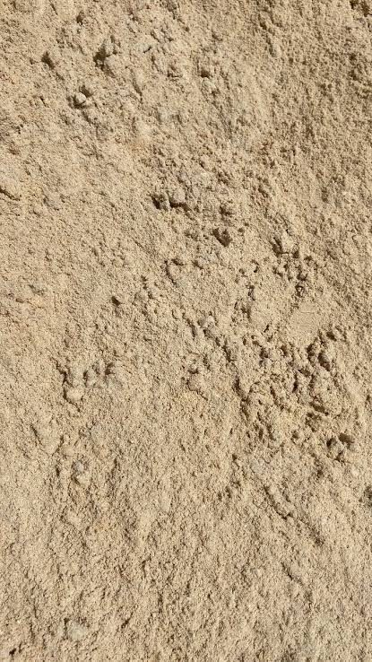 Applying White Sand on Grass — Port Stephens, NSW — Thunder Landscape Supplies