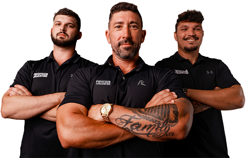 Three men are standing next to each other with their arms crossed.