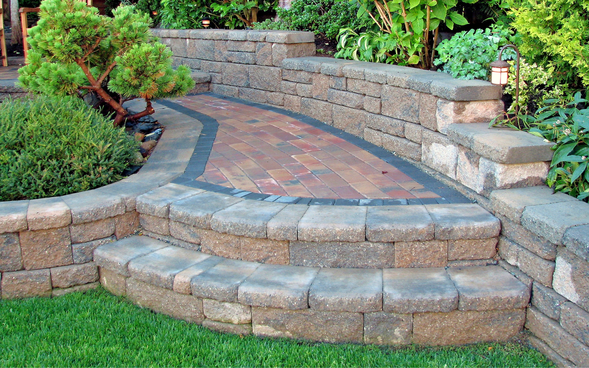 Stone walkway and wall with steps to the yard