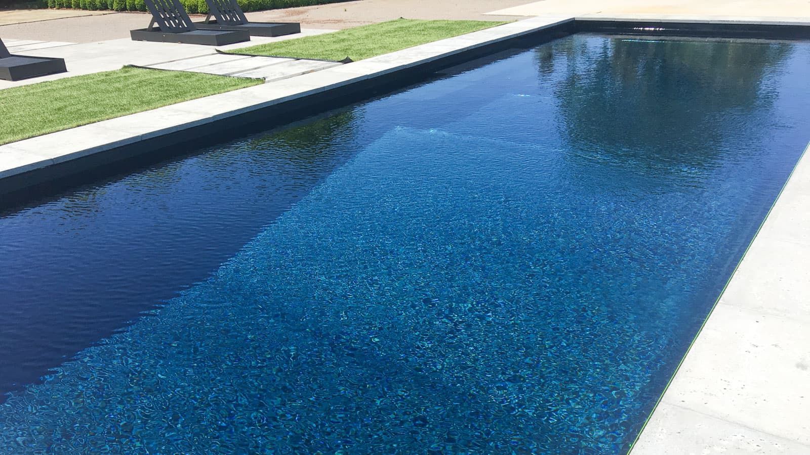 The Celebration Pool Layout with Volcanic Black Pool Color - Close-up left
