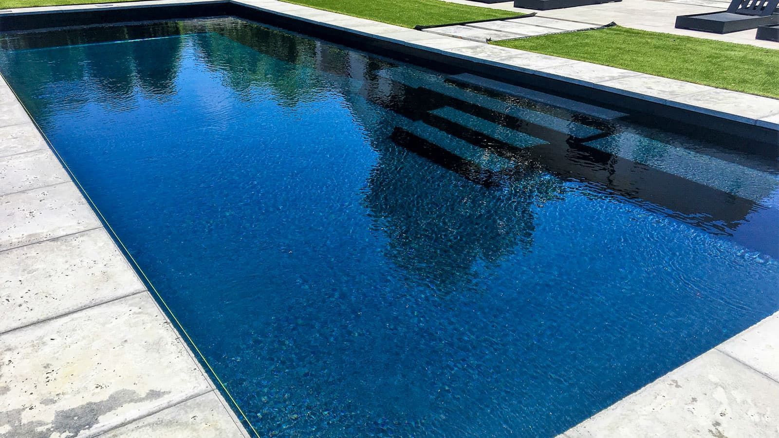 The Celebration Pool Layout with Volcanic Black Pool Color - Close-up right