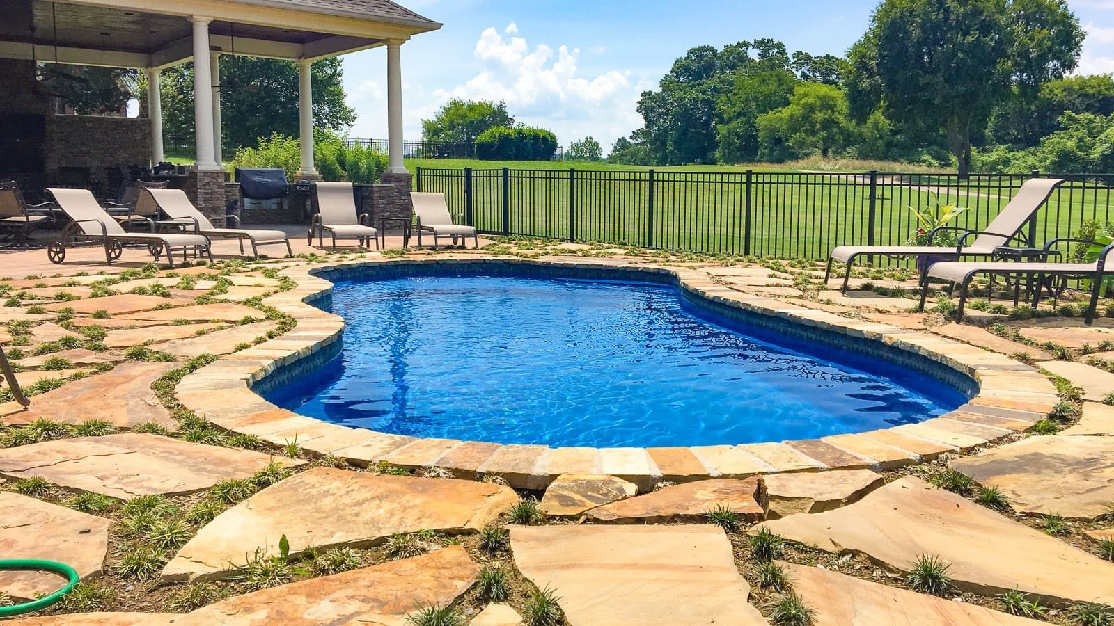 The Fantasy Pool Range with stone hardscape surrounding it. 