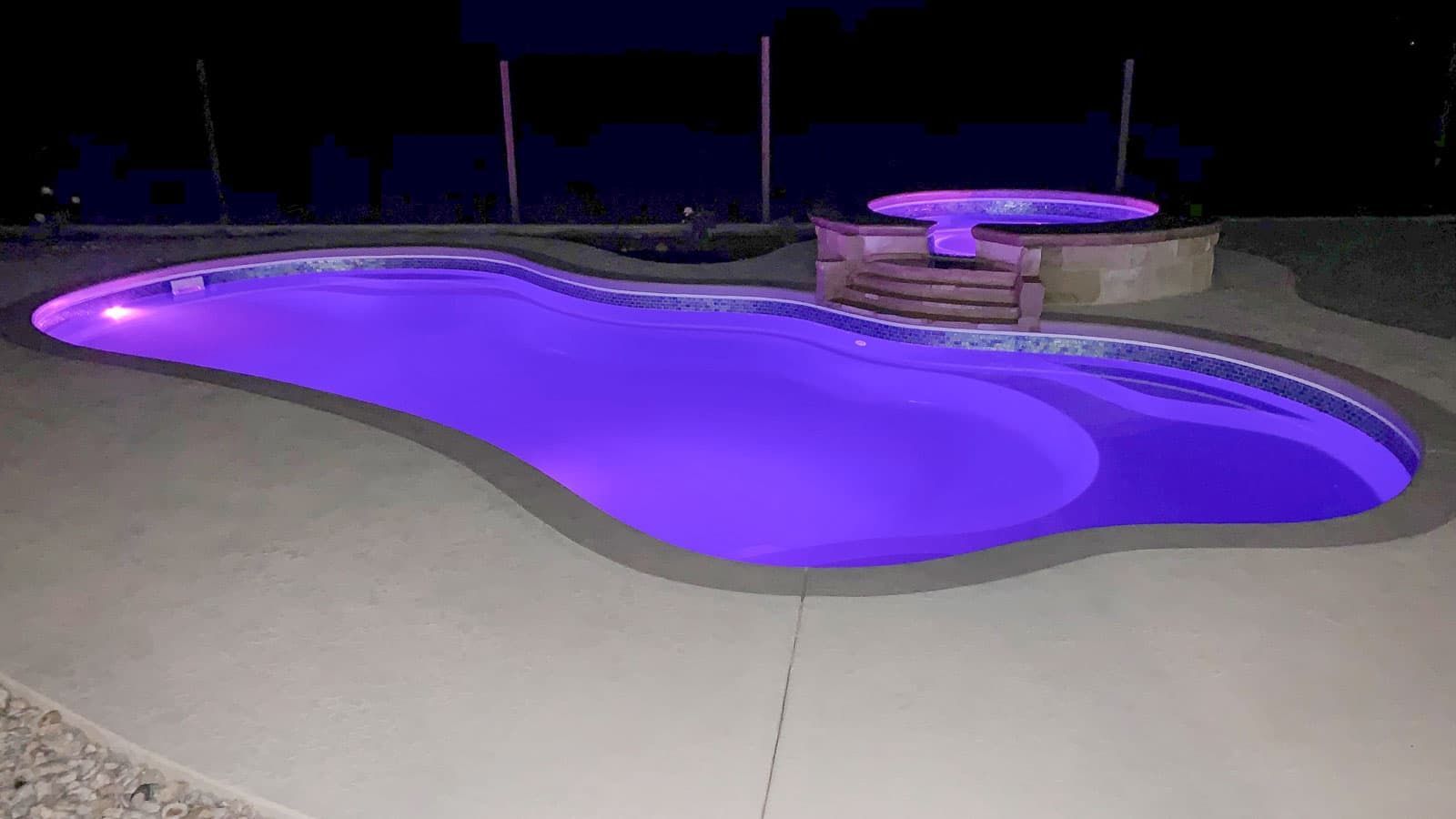 The Fantasy Pool Range lit up with a neon light at night
