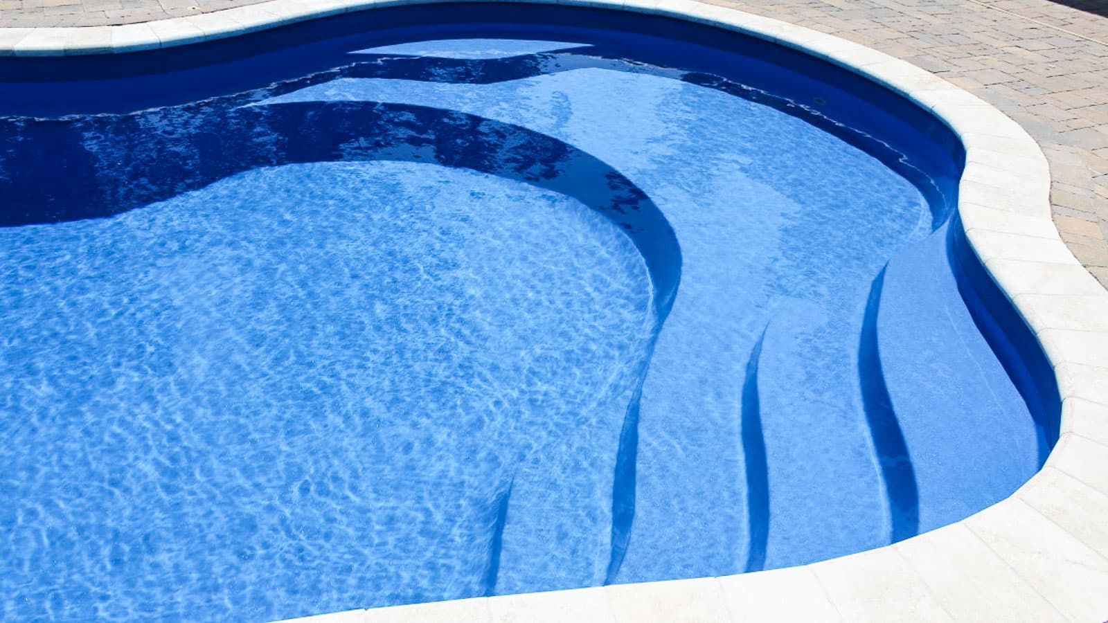 Close up of the steps and built-in bench in The Fantasy Pool Range
