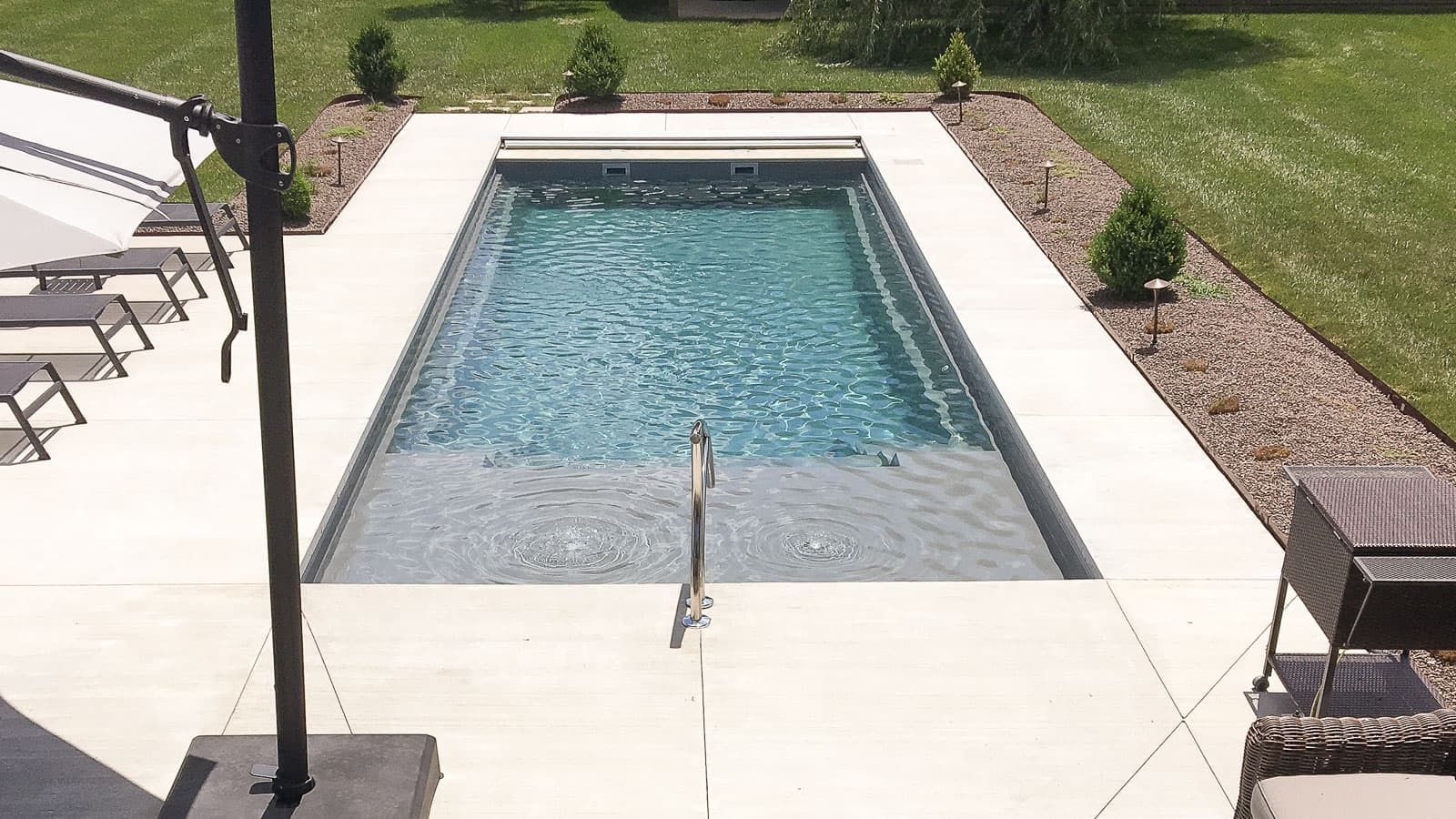 The Freedom Pool Range with Splash Pad in Volcanic Black Pool Color