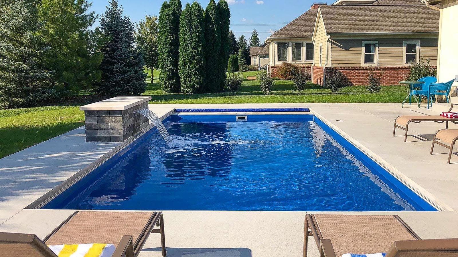 The Freedom Pool Range with a custom stone fountain - side profile. 