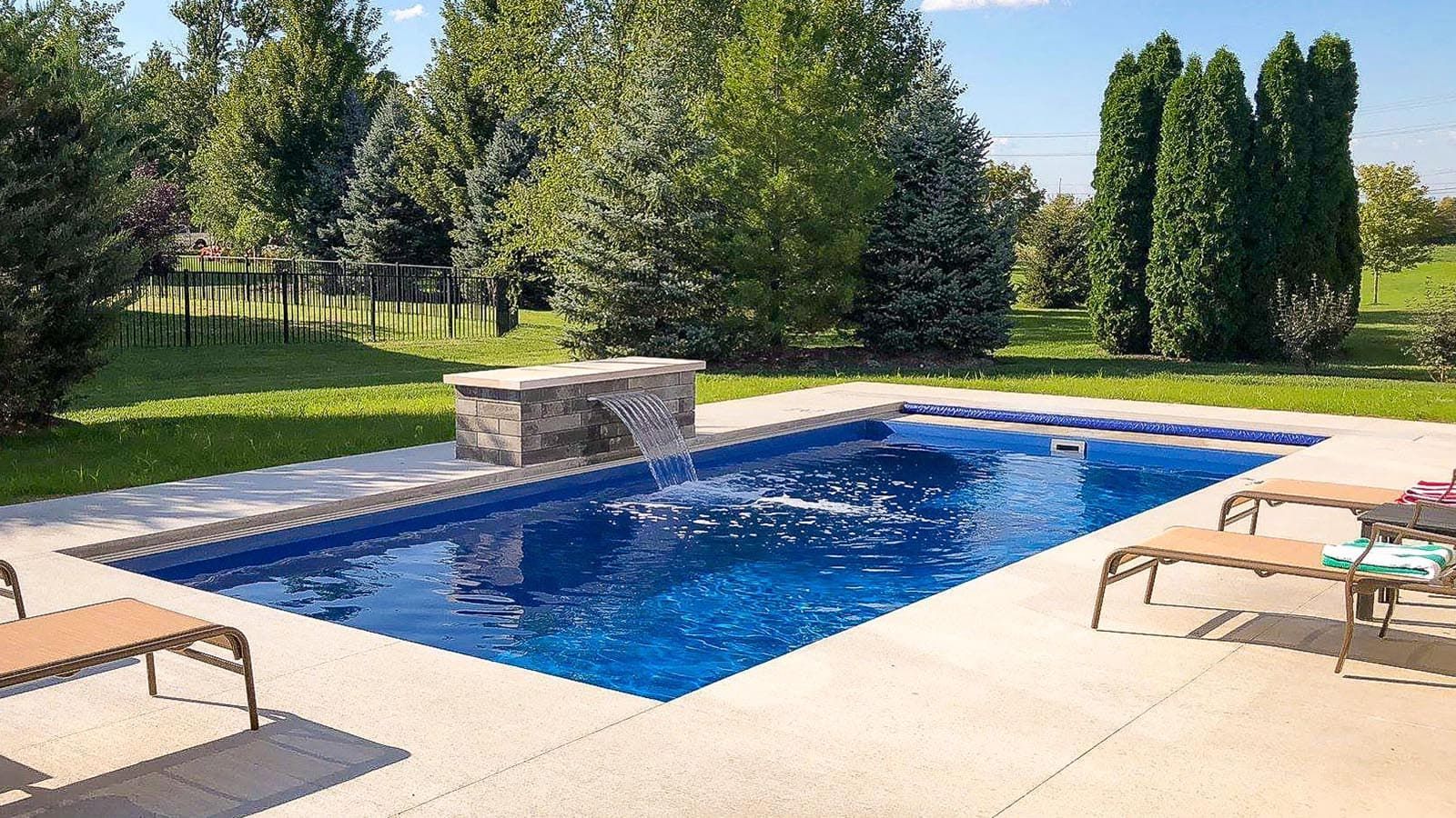 The Freedom Pool Range with a custom stone fountain - front profile. 