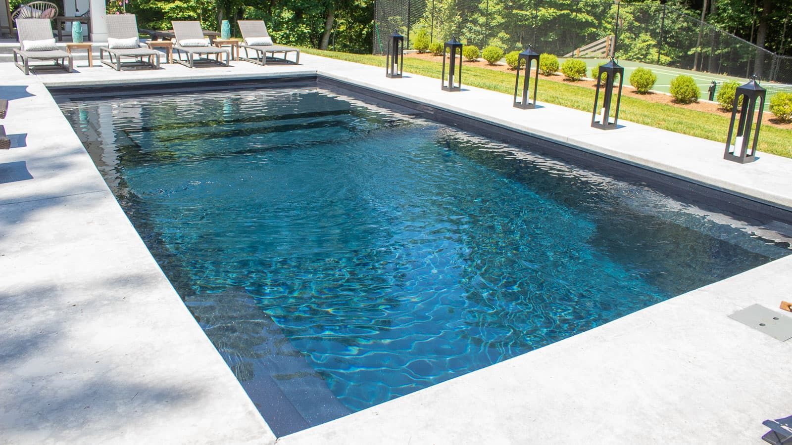 Side Profile of The Illusion Pool Layout in Volcanic Black Pool Color