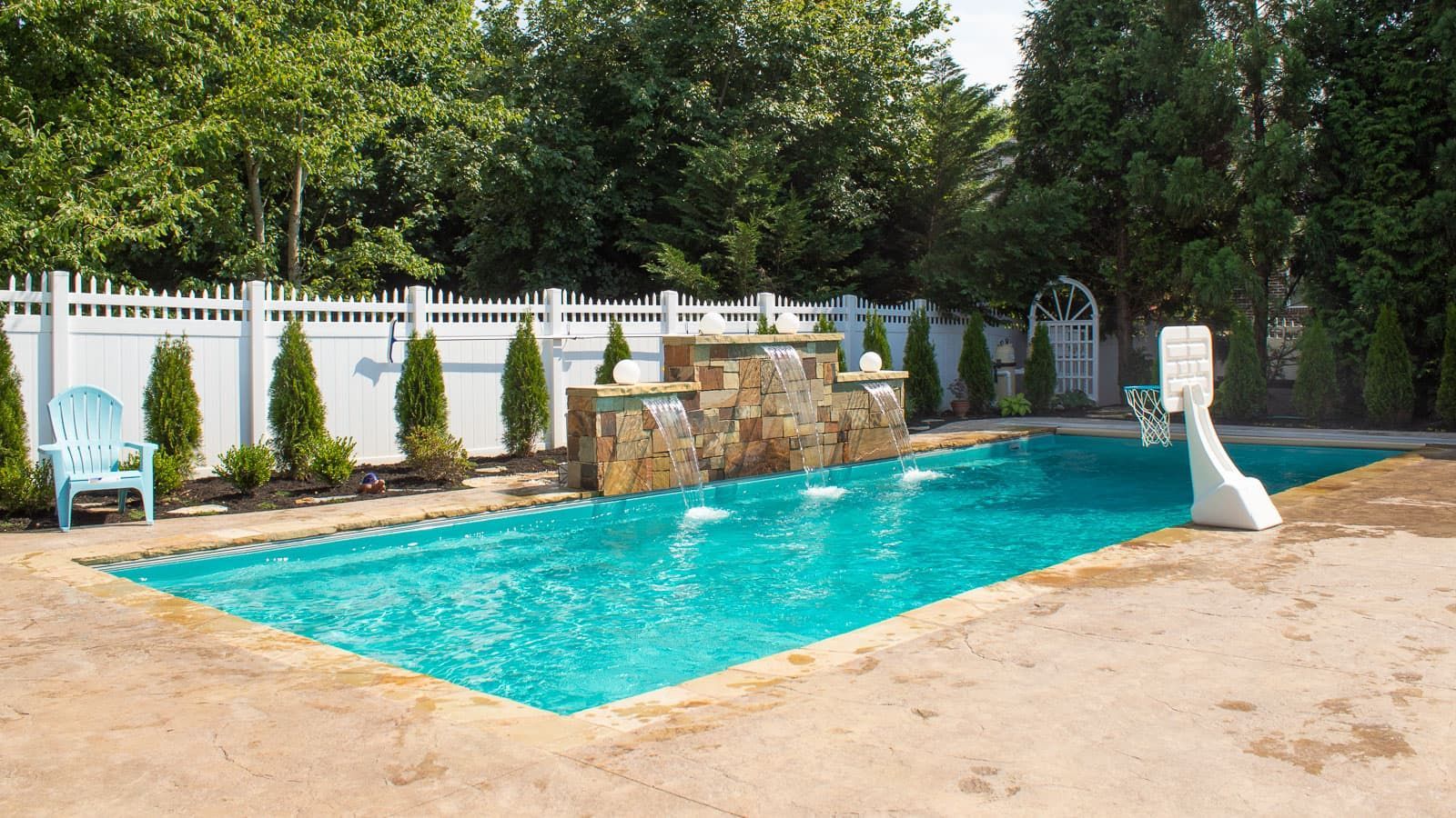 The Illusion Pool Range in Reef Blue with an aquatic basketball goal on the side for play