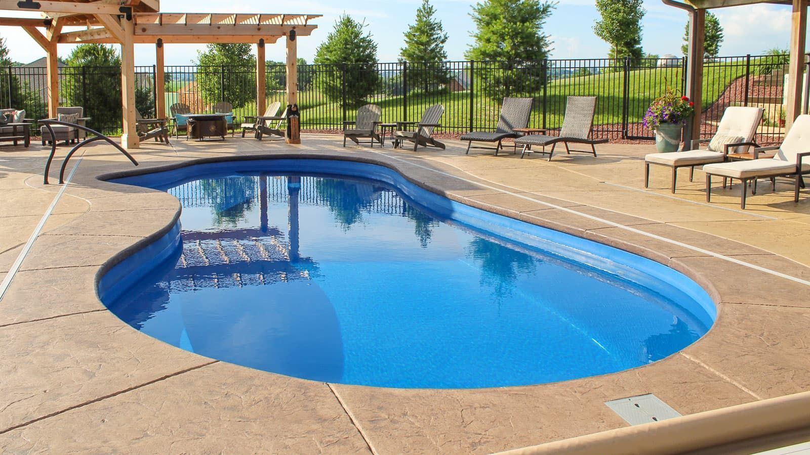 The Inspiration Pool Range Layout on a beautifully crafted porch with hardscape and landsape accenting it. 