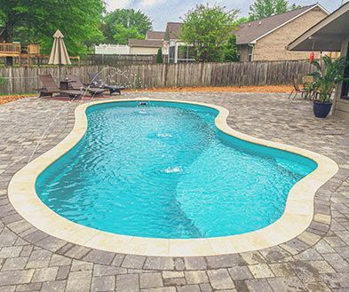 Lifestyle picture of the Coral Blue Pool color in a pool. 