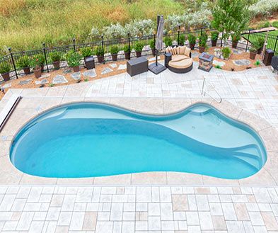 Lifestyle image of the Ice Silver Pool Color installed in a Poor Boy Pool.
