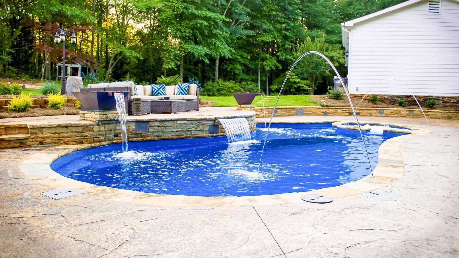 The Brilliant Pool Layout with Ocean Blue Pool Color and Stone Hardscape