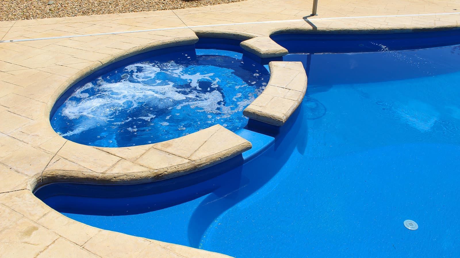 Hot tub section of The Brilliant Pool Layout - Fiberglass Inground Pools by Poor Boy Landscape and Hardscape