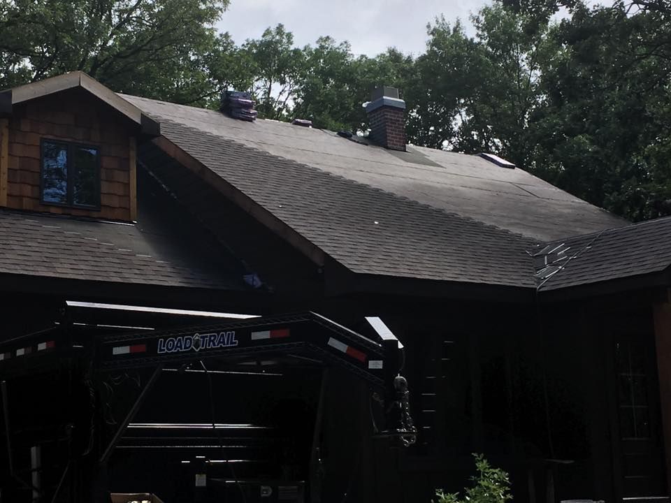 A House With Shingles Roof | New Richmond, WI | DC Roofing Inc.