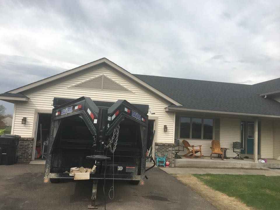 A Truck In Front Of A House | New Richmond, WI | DC Roofing Inc.
