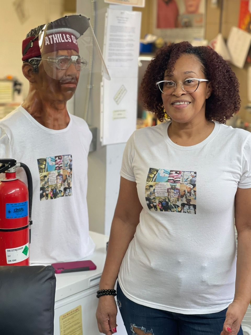 A man and a woman wearing face shields are standing next to each other.