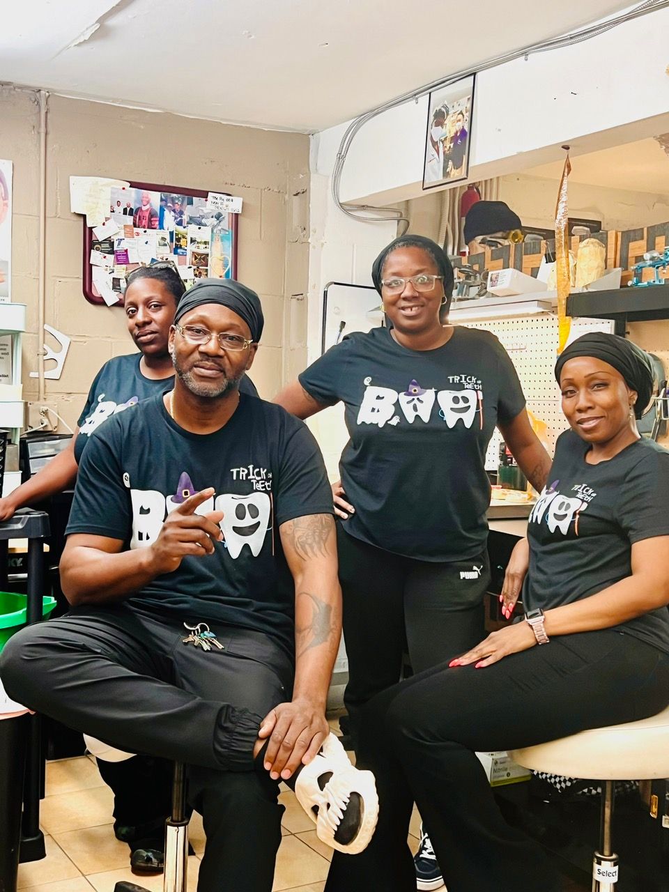 A group of people are posing for a picture in a room.