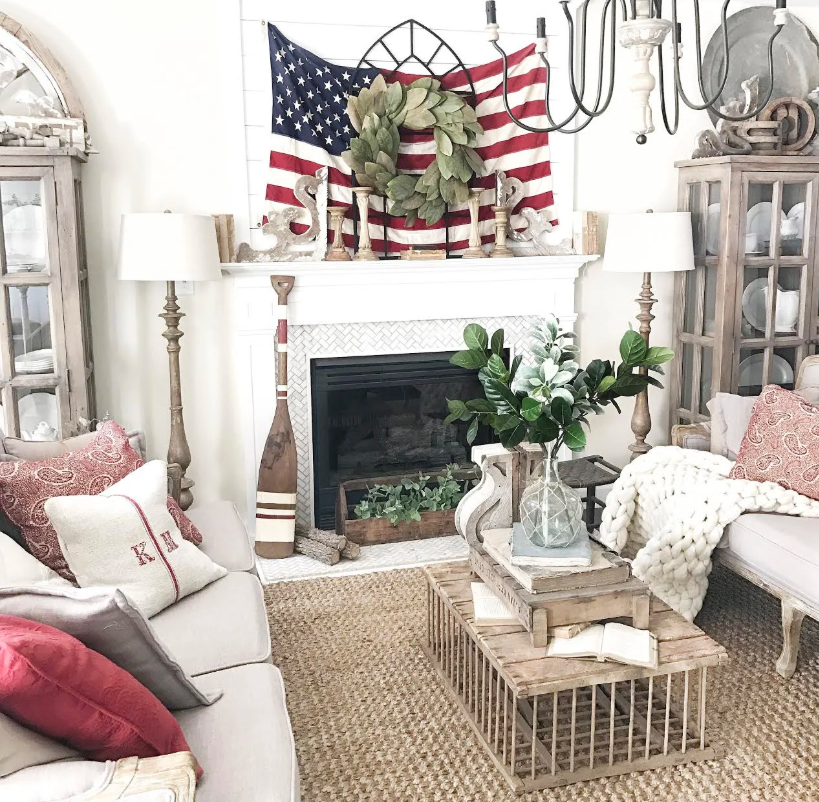 Living room decorated with American flag, wreath, and nautical elements. Living room decorated with American flag, wreath, and nautical elements.