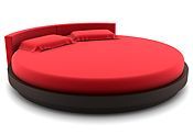 A round bed with red sheets and pillows on a white background.