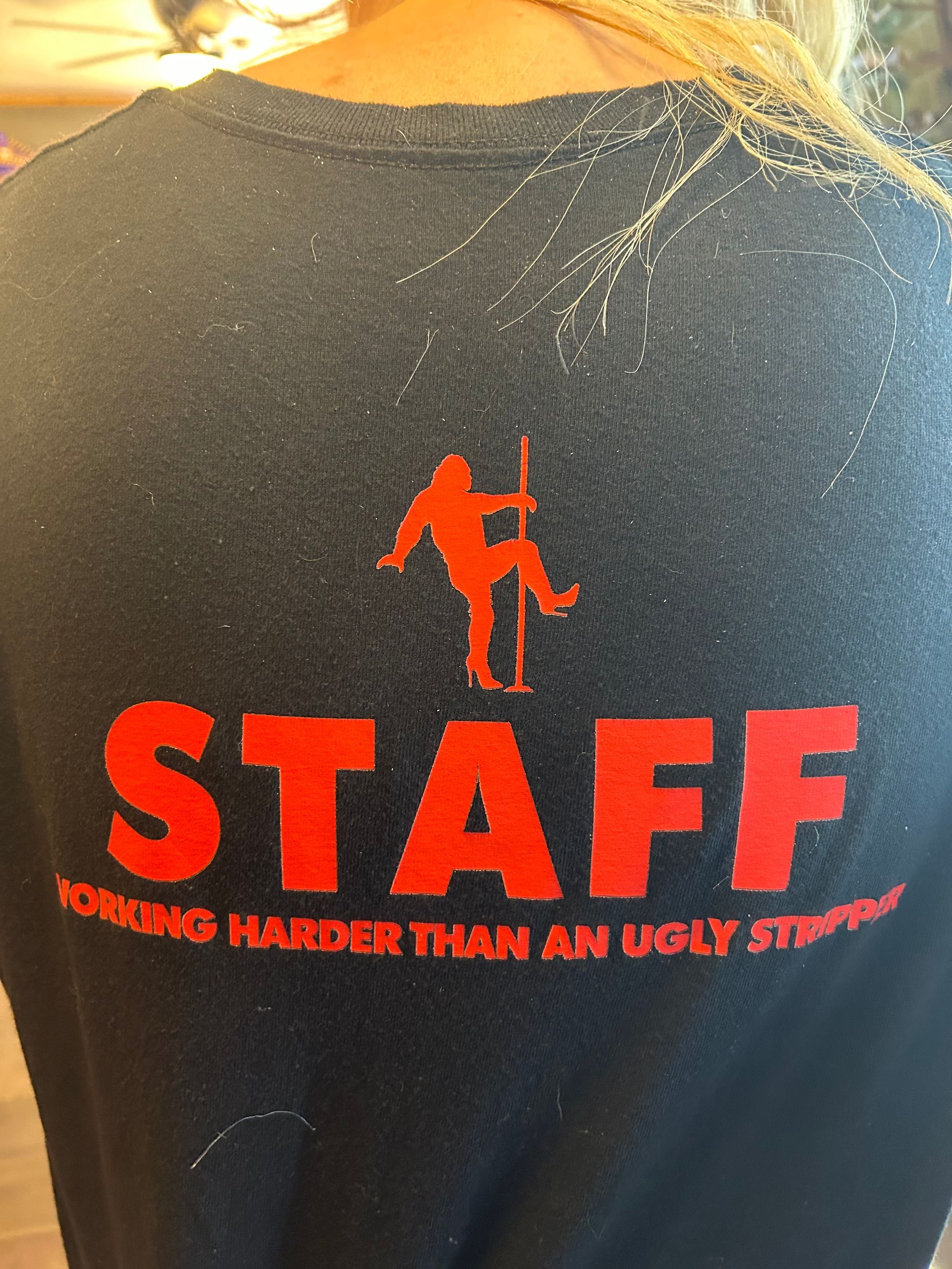 A black shirt that says staff on it