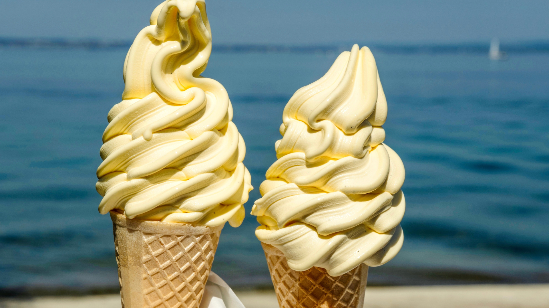 Assortment of golden-brown pastries: croissants, cinnamon rolls, and filled puff pastries.