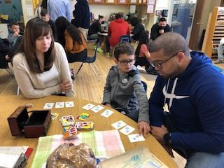 montessori child working on an activity with a guide