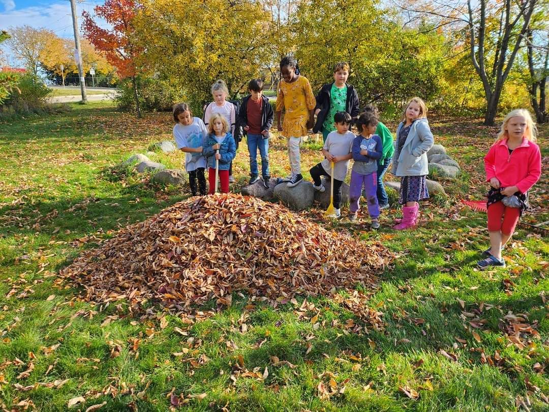 Montessori children working on an activity with a guide