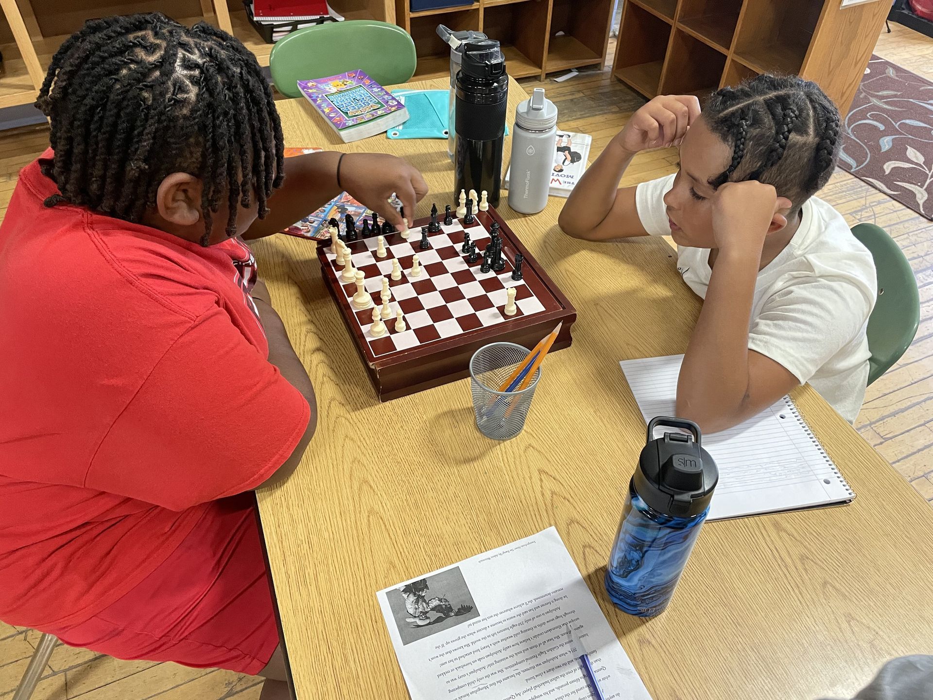Montessori children playing chess