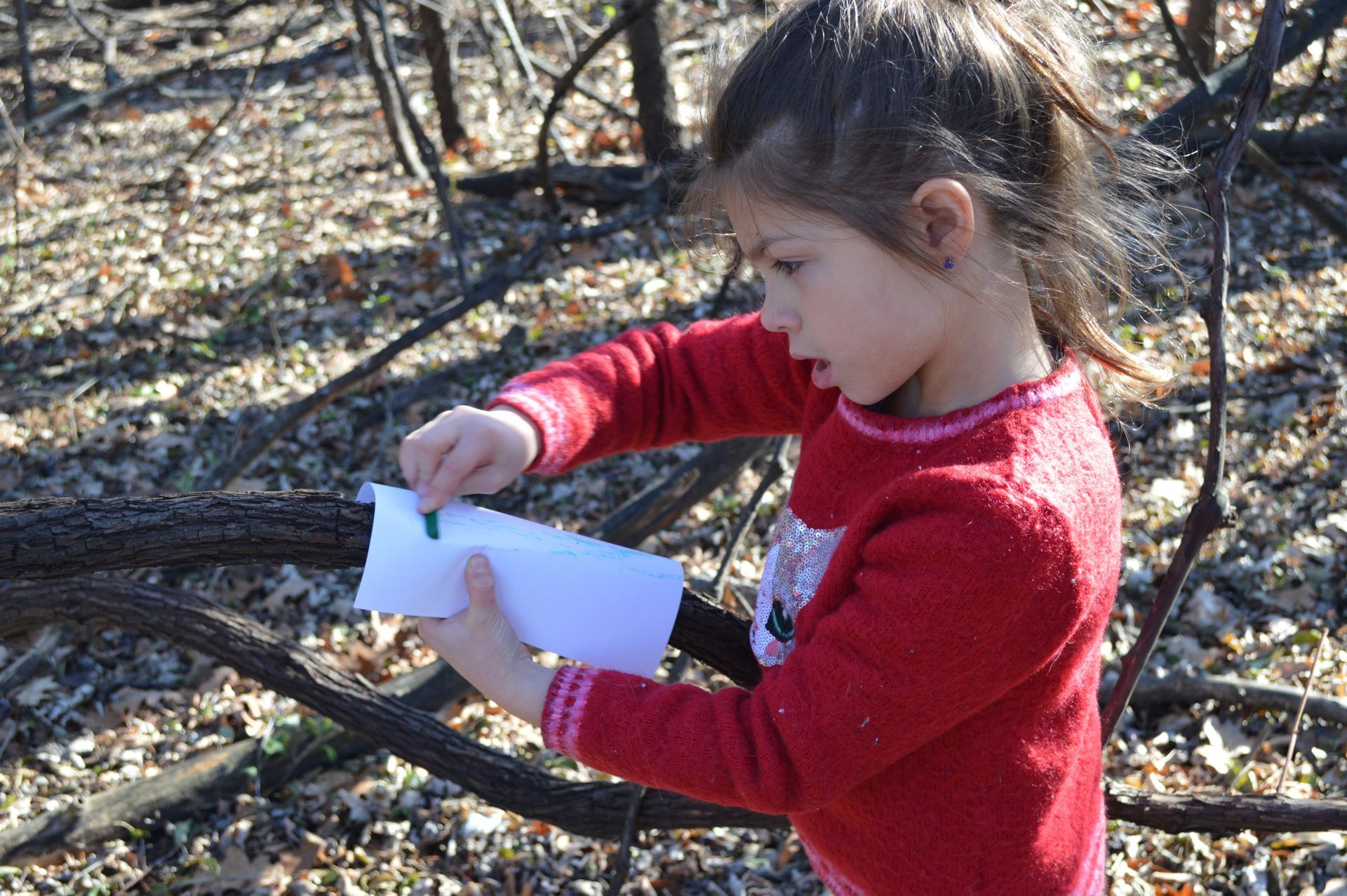 montessori child working outdoors