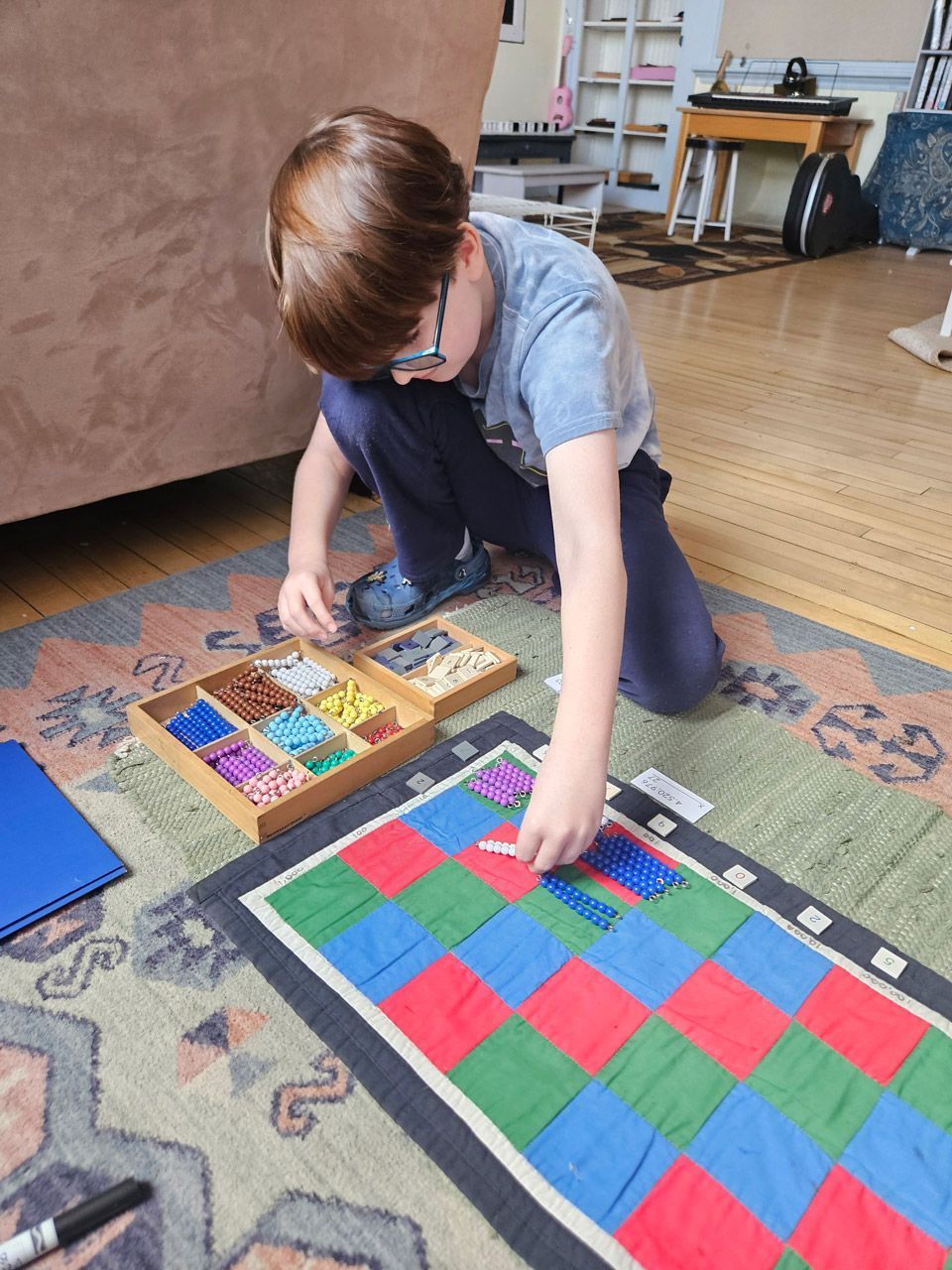 montessori child working with math materials 
