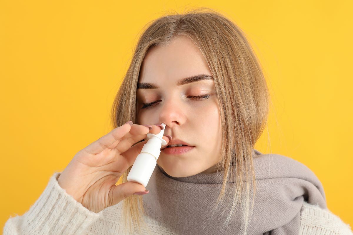 woman with nasal spray