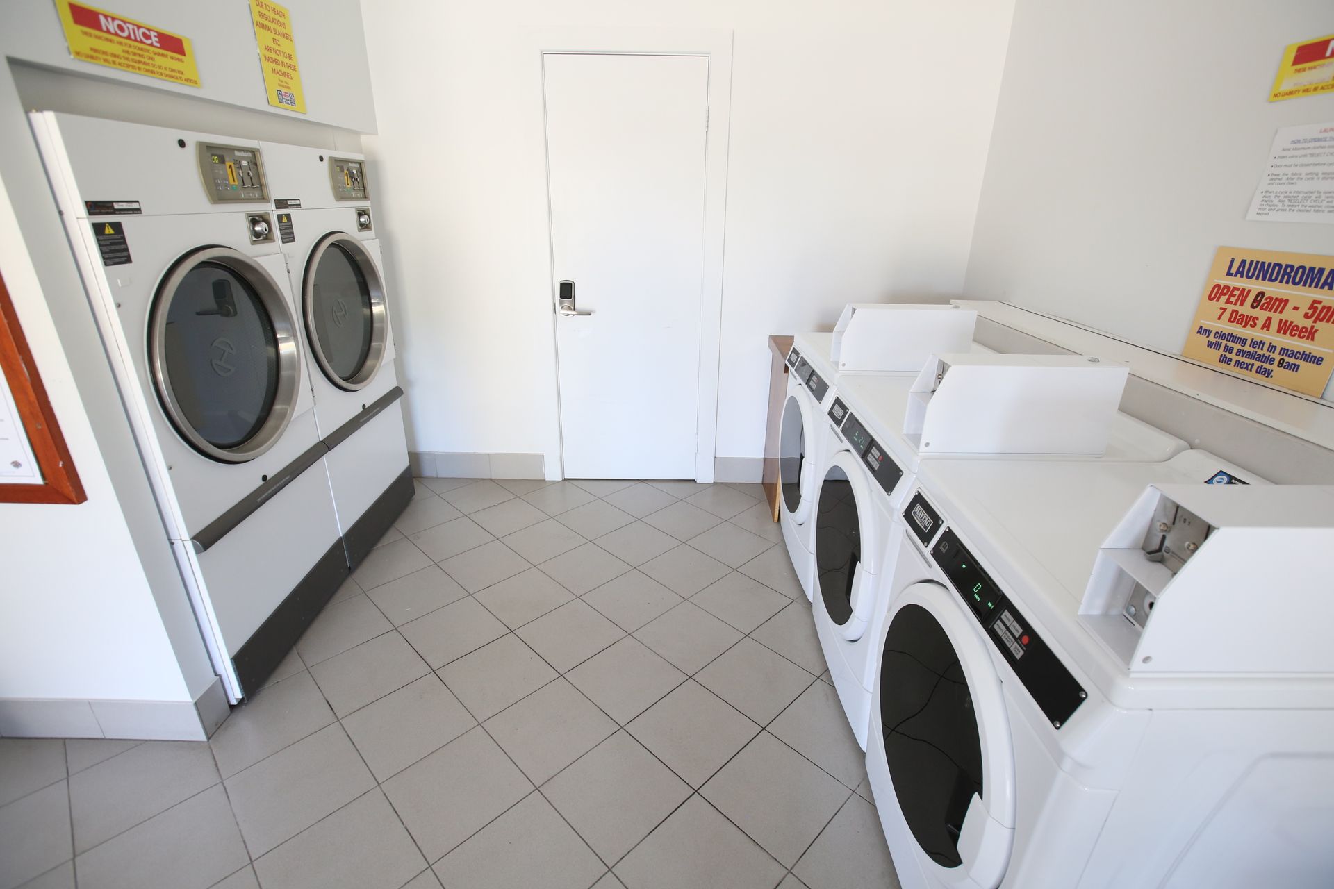 A laundromat with several washers and dryers