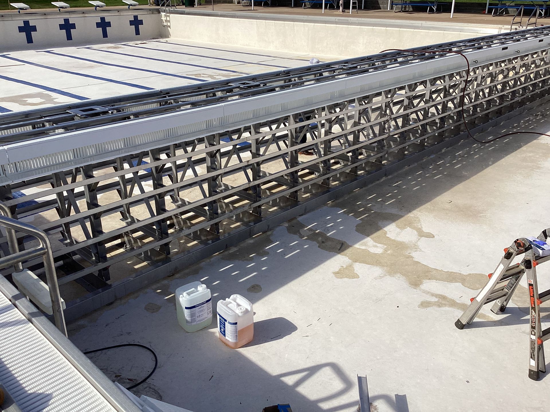 Family gathered at a dining table in a kitchen. They are eating and talking together.