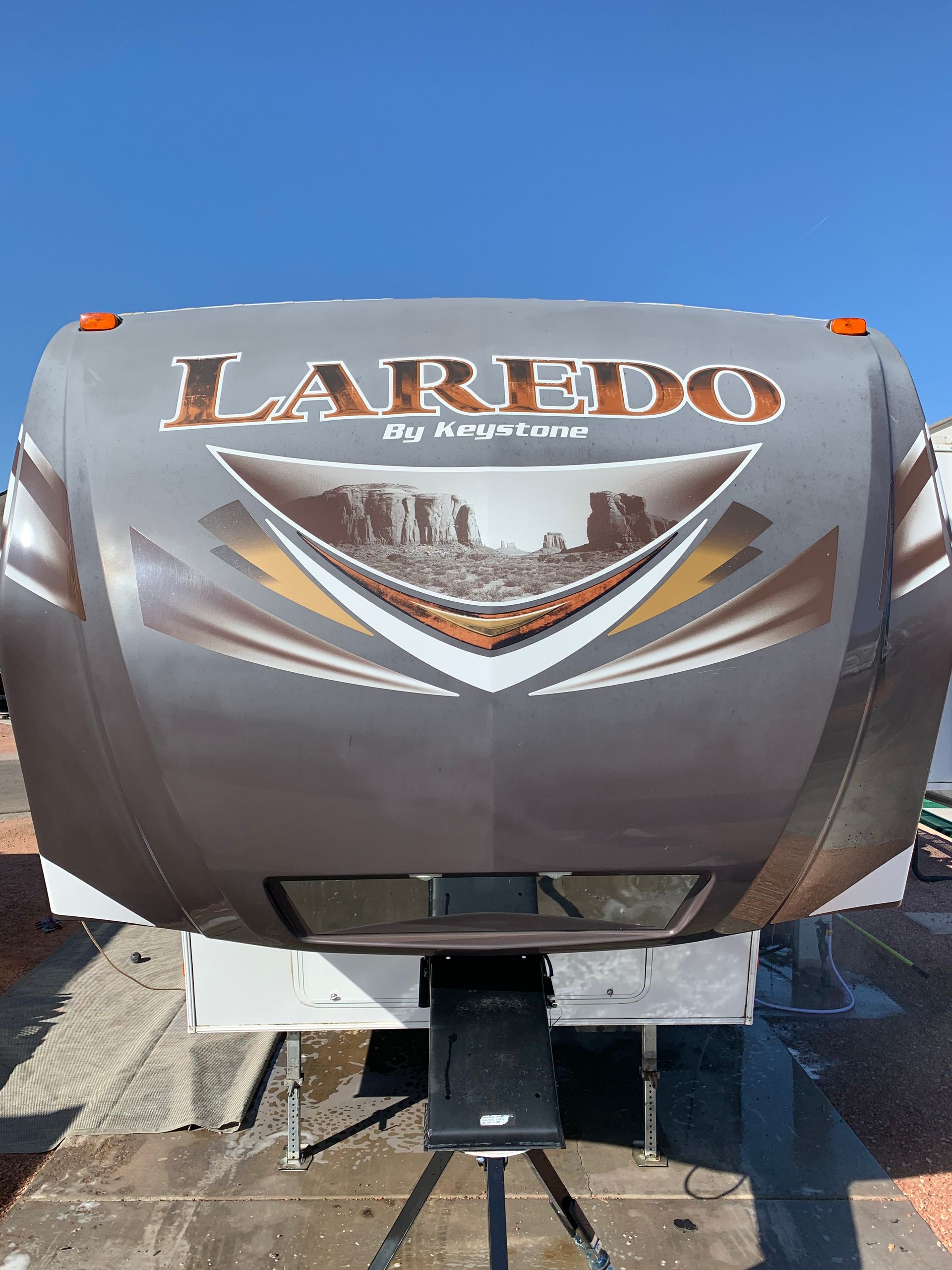 A laredo rv is parked on the side of the road.