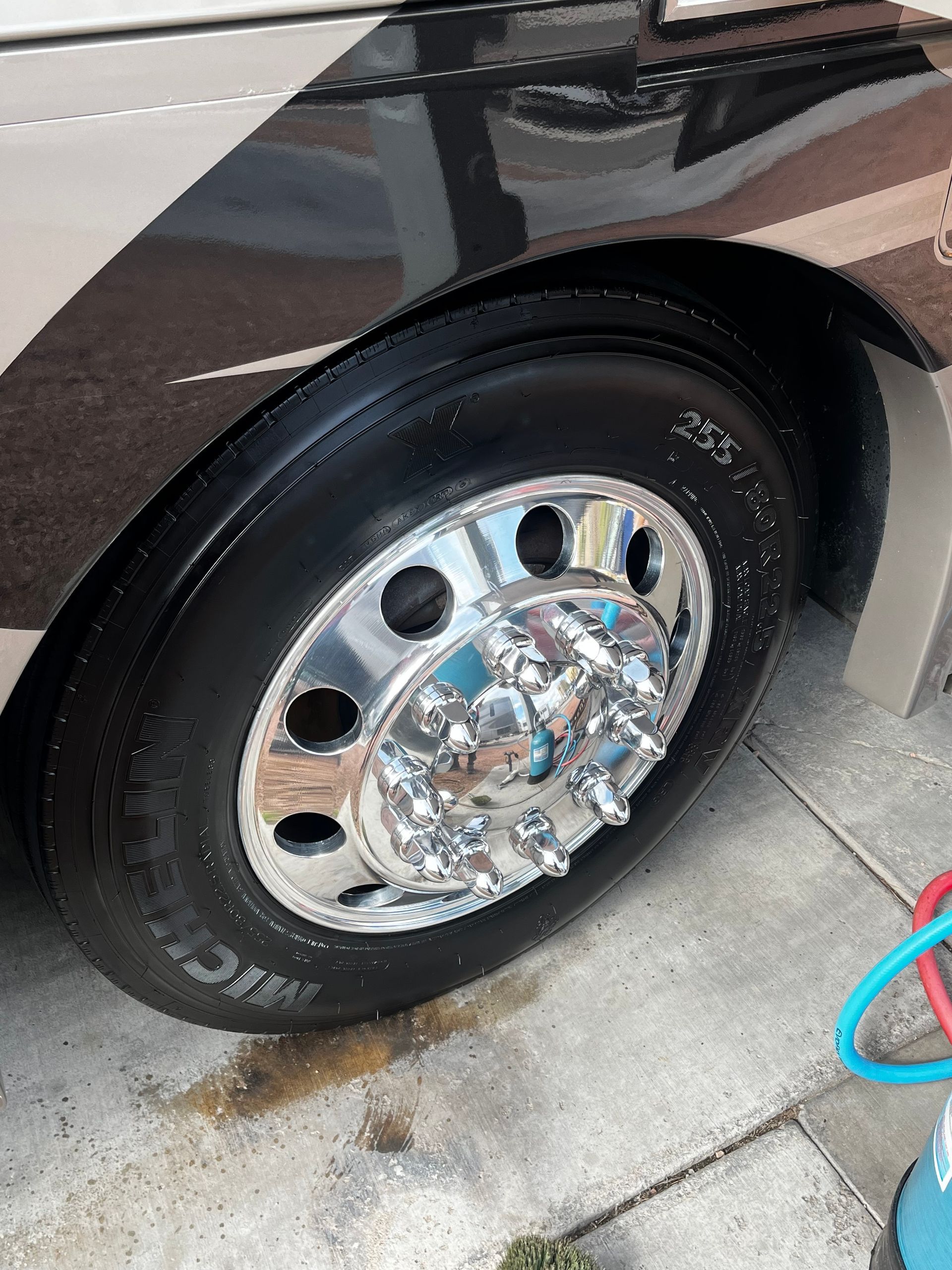 A close up of a tire on a truck with a chrome rim