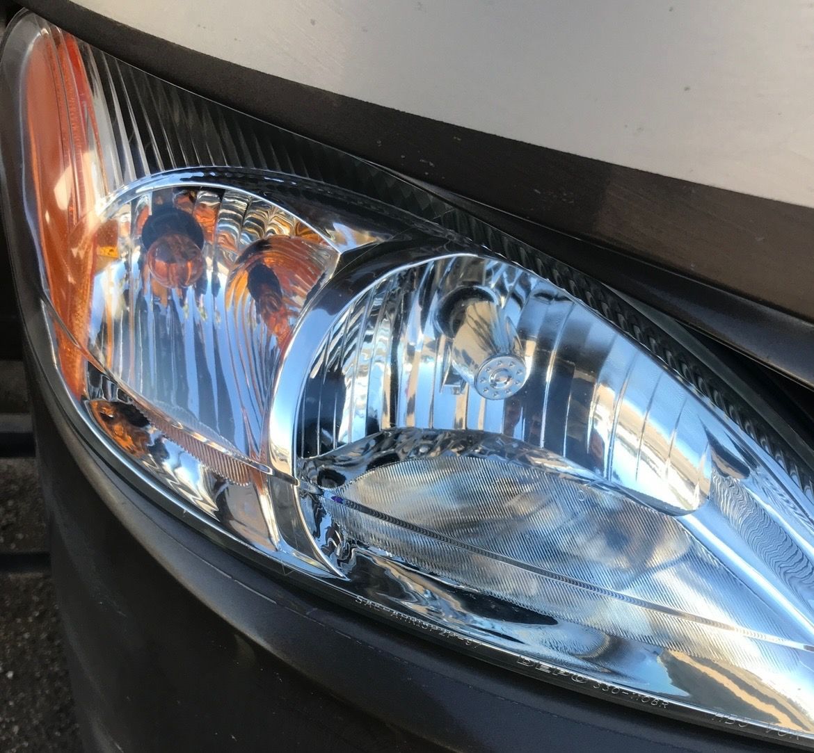 A close up of the headlight of a car