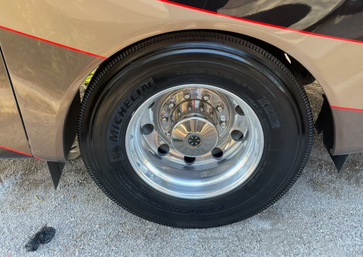 A close up of a michelin tire on a car