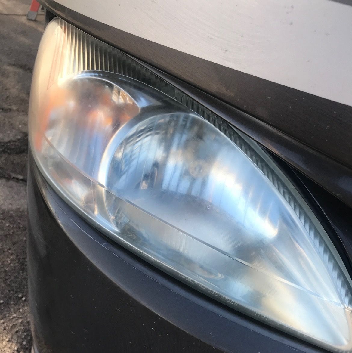 A close up of the headlight of a car