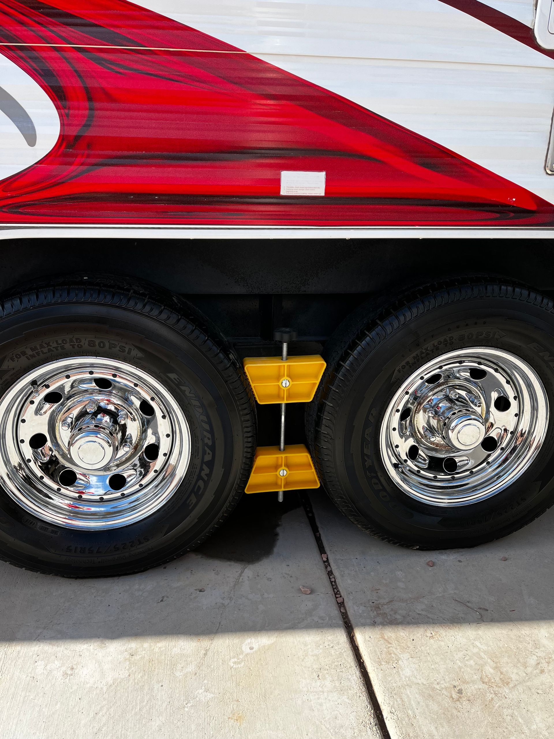 A close up of a truck 's wheels and tires