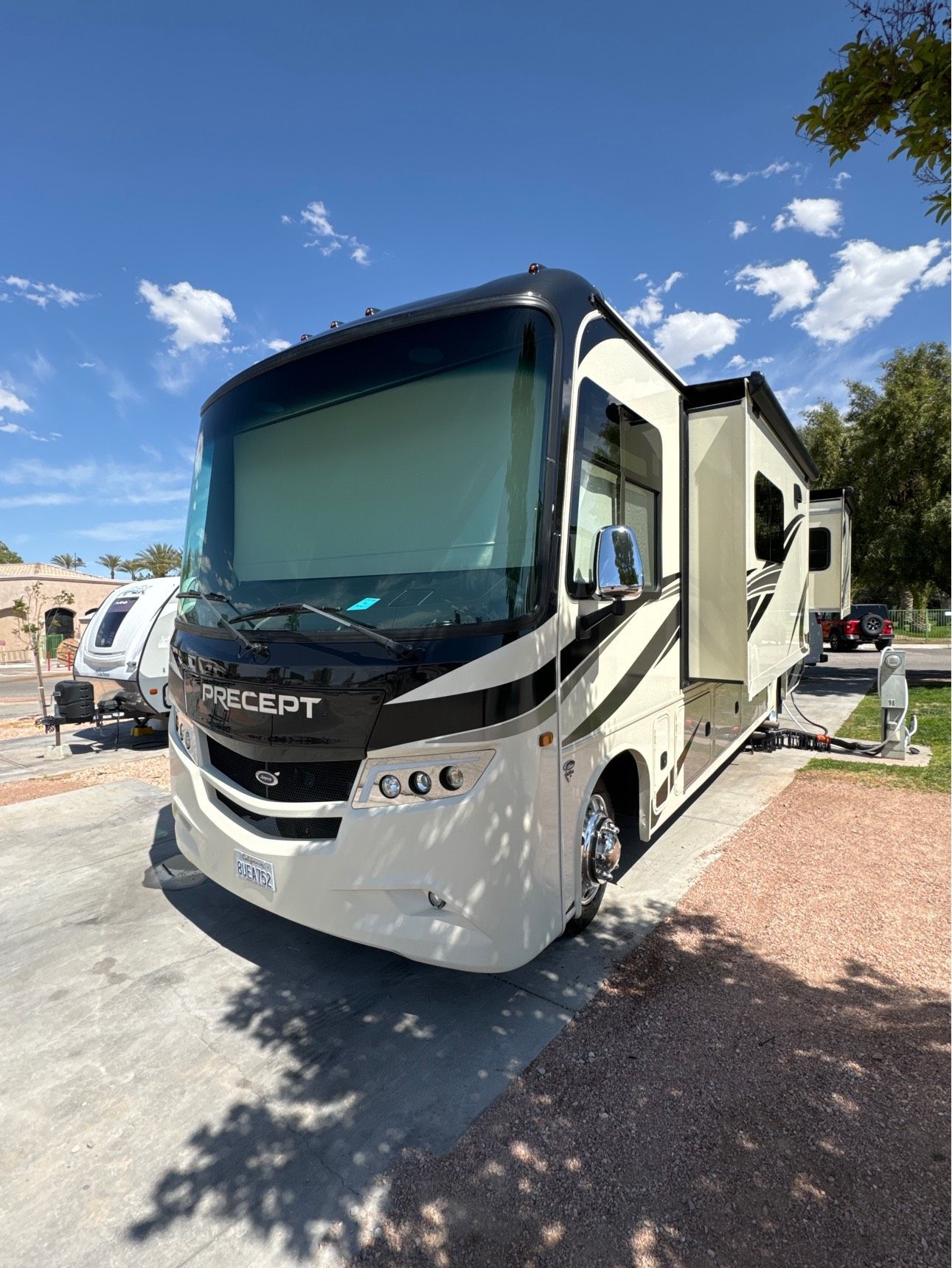 A large rv is parked in a parking lot.