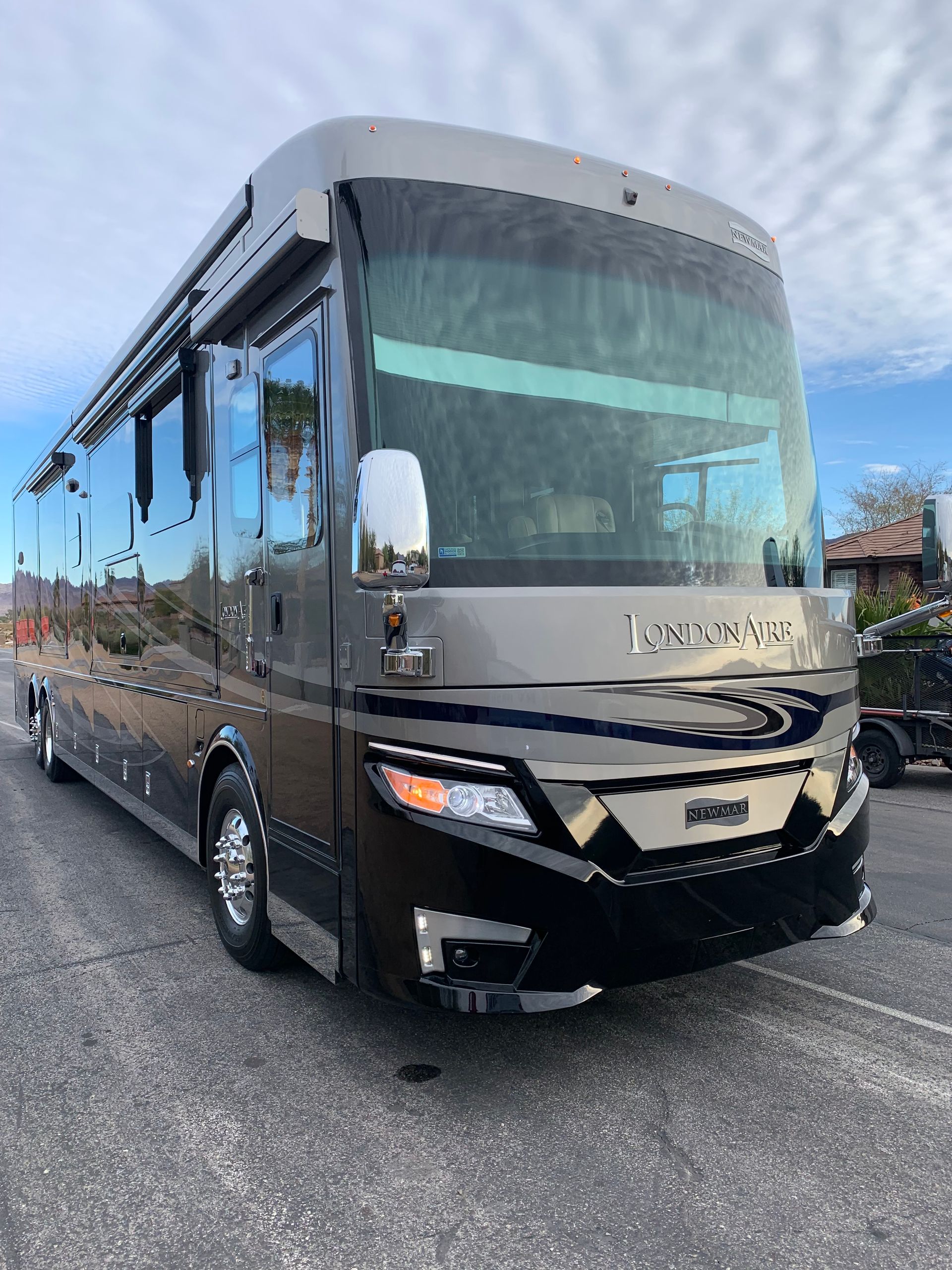 A large bus is parked on the side of the road.