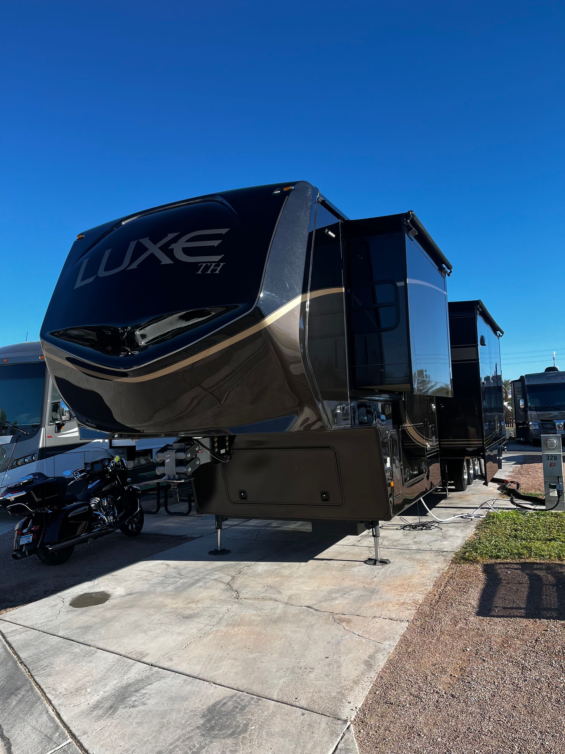 A large rv is parked in a parking lot.