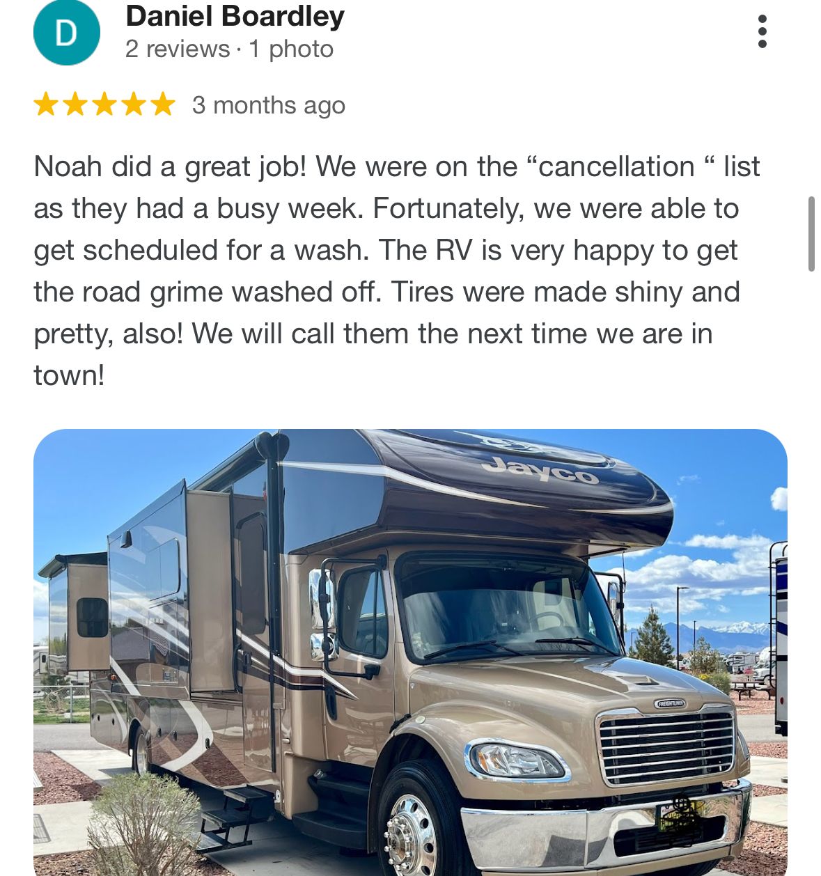 A picture of a rv parked on the side of the road.