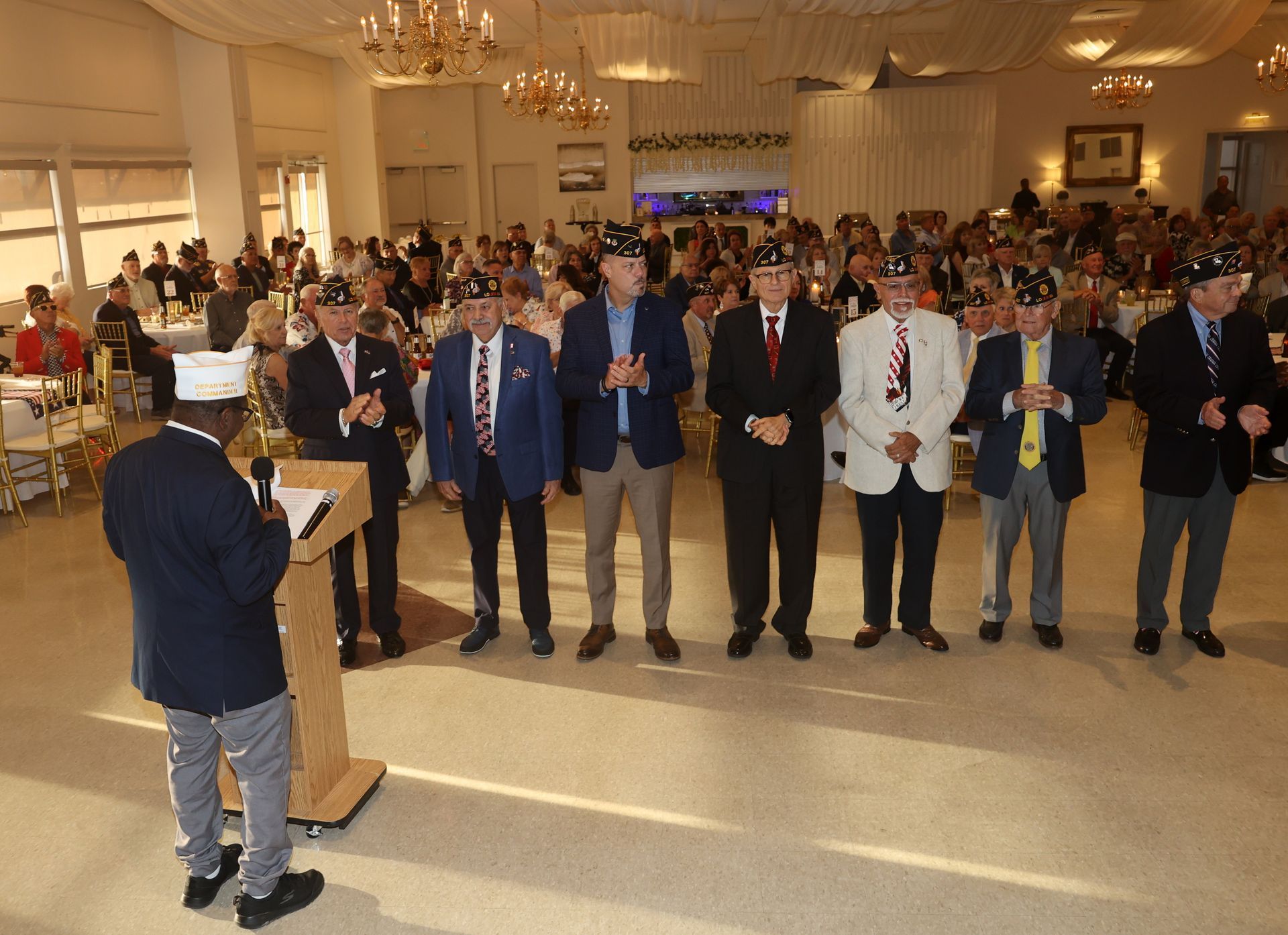 A group of men in suits and ties pose for a picture