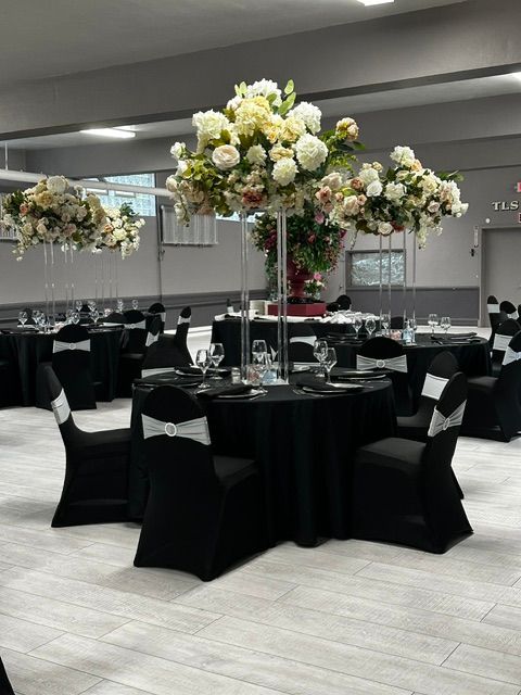 Decorated venue for an anniversary celebration featuring black and silver decor

