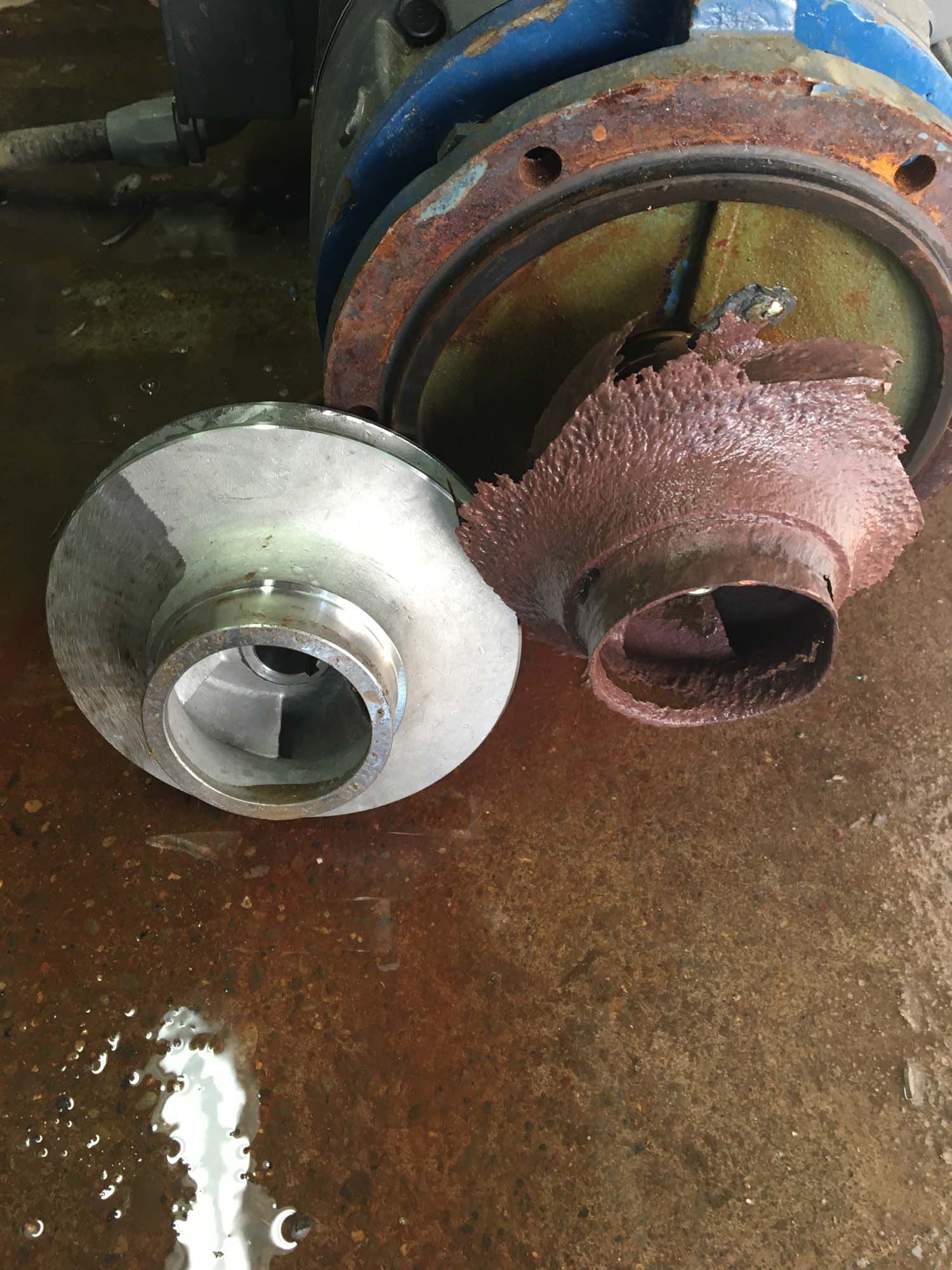 A close up of a rusty metal object on a table.