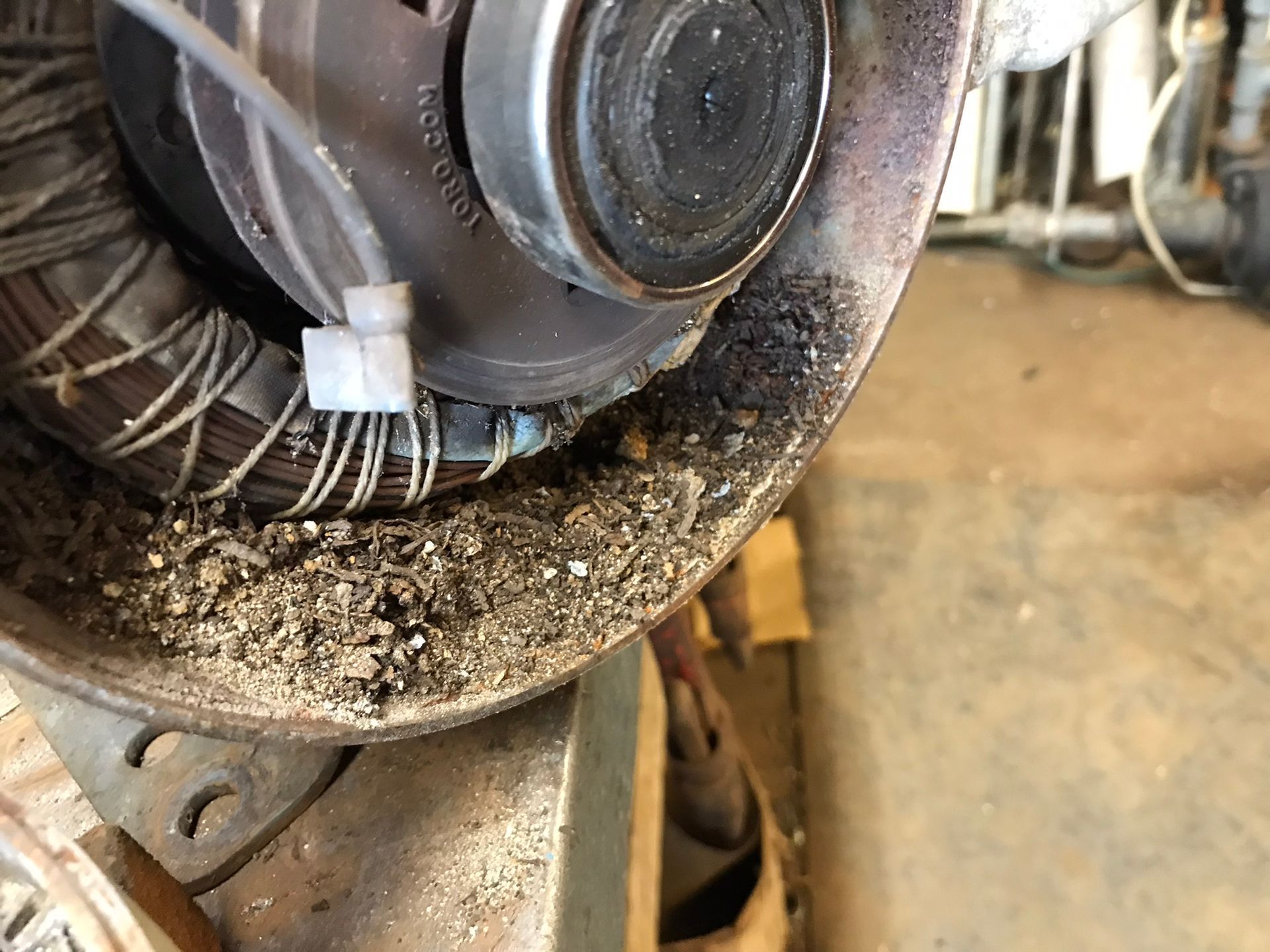 A close up of a machine with a lot of dirt on it