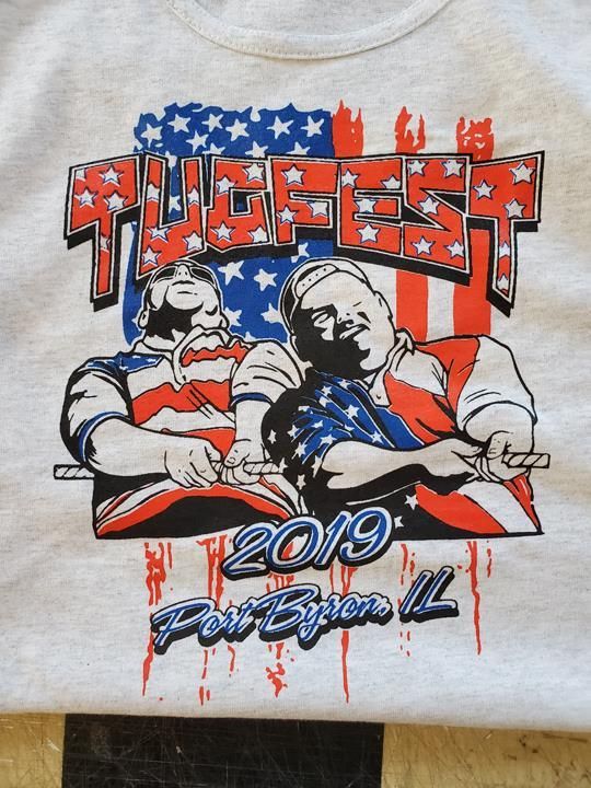 Tugfest 2019 shirt featuring two men pulling a rope, with an American flag design. Event held in Port Byron, IL.