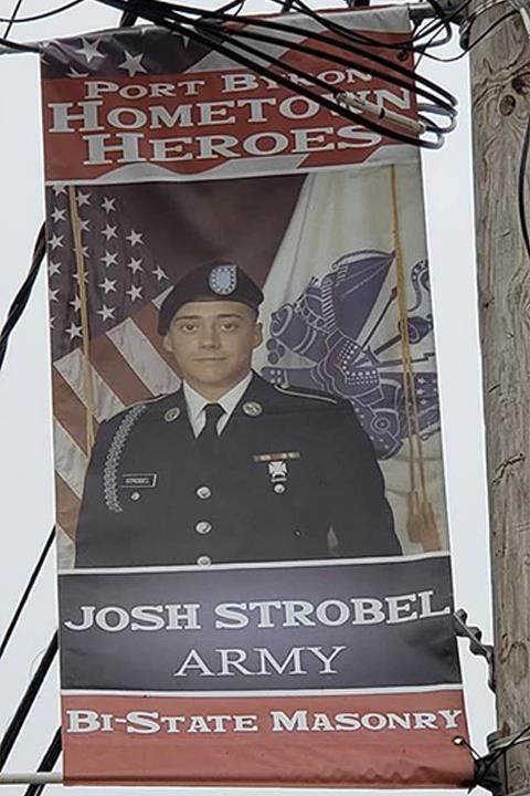 Banner honoring Josh Strobel, a U.S. Army soldier. It features his photo, the American flag, and the name 